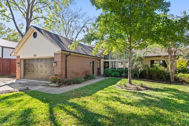 view of side of home with a yard and a garage