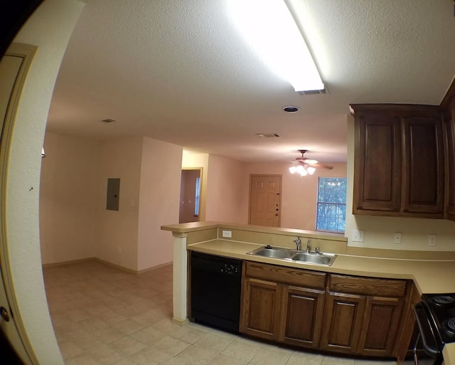 kitchen with kitchen peninsula, a textured ceiling, ceiling fan, sink, and black appliances