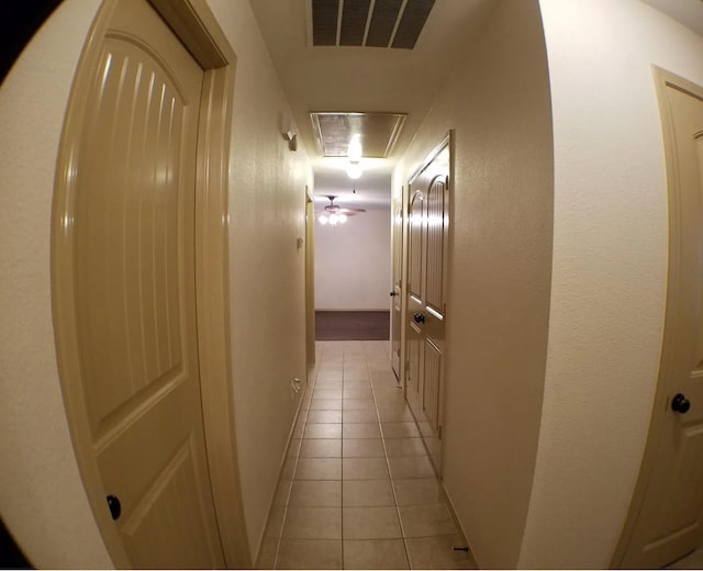 corridor with light tile patterned floors