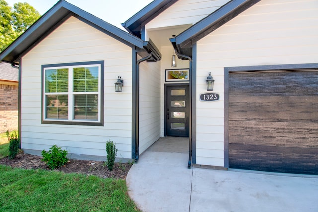 property entrance with a garage