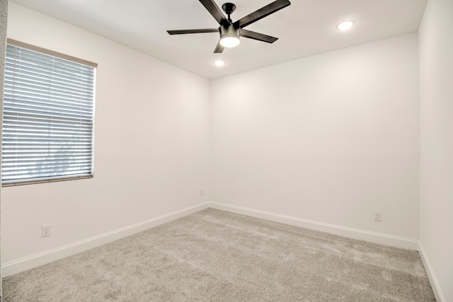 carpeted empty room with ceiling fan