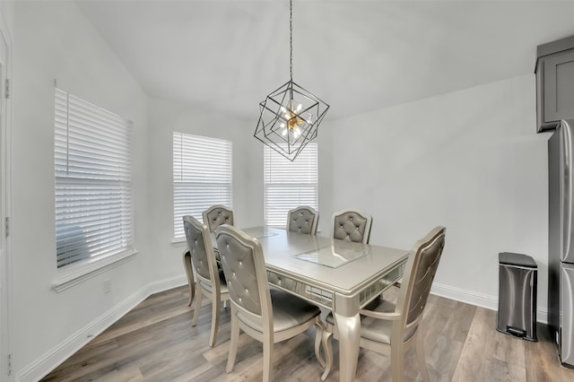 dining area featuring a chandelier and hardwood / wood-style flooring