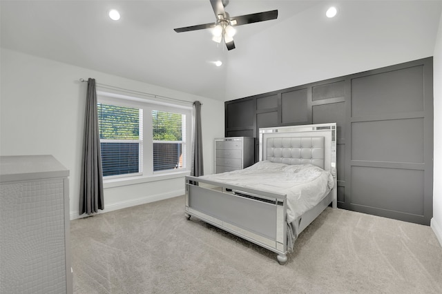 unfurnished bedroom with ceiling fan, lofted ceiling, and light carpet