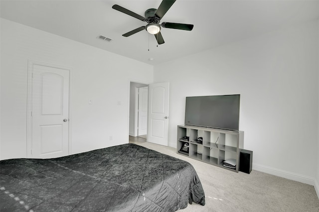 bedroom with ceiling fan and light carpet