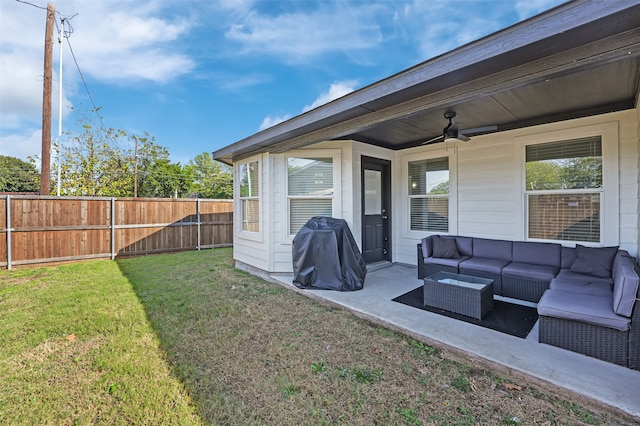 view of yard featuring a patio area, ceiling fan, and an outdoor living space