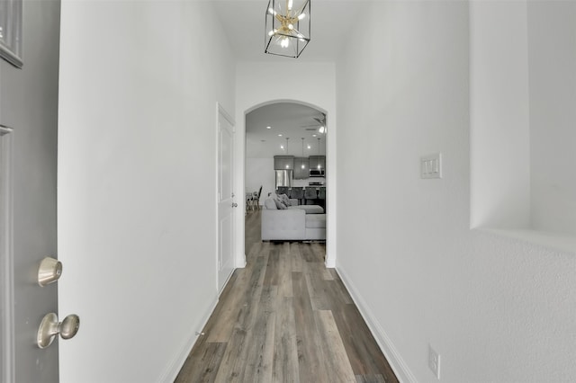 corridor with hardwood / wood-style floors