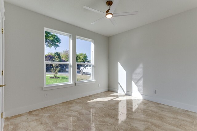 spare room with ceiling fan