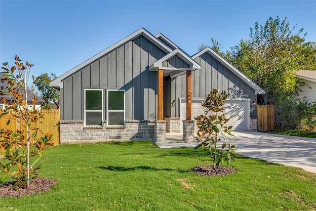 view of front of property with a front lawn and a garage