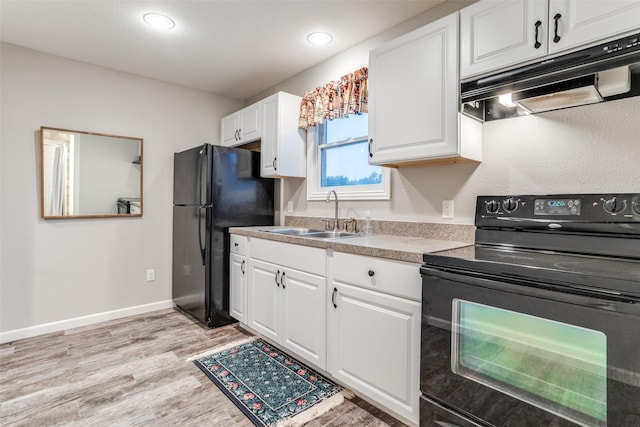 1491 County Road 456, Princeton, TX 75407 - kitchen featuring white cabinetry, sink, black appliances, and light hardwood / wood-style floors