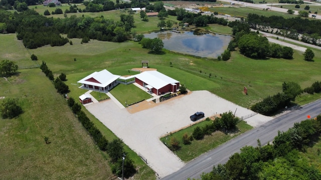 birds eye view of property with a water view and a rural view