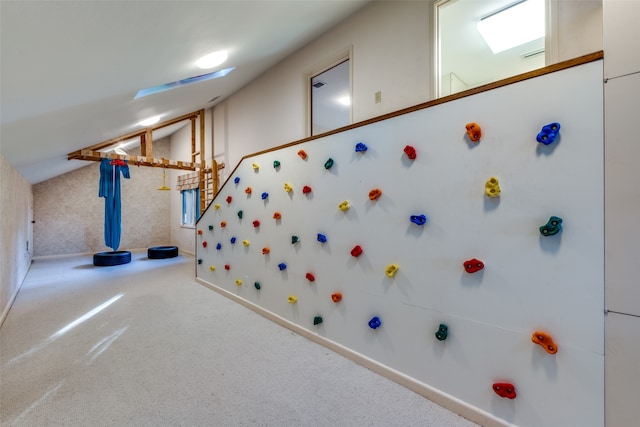 playroom with carpet and lofted ceiling