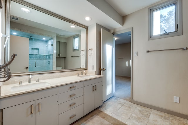 bathroom featuring vanity, an enclosed shower, tile patterned flooring, and plenty of natural light