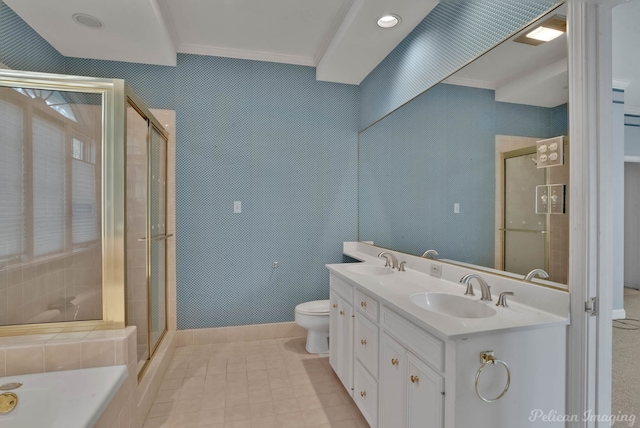 bathroom with vanity, toilet, a shower with shower door, and crown molding