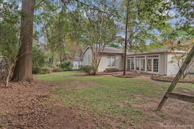 view of yard featuring french doors