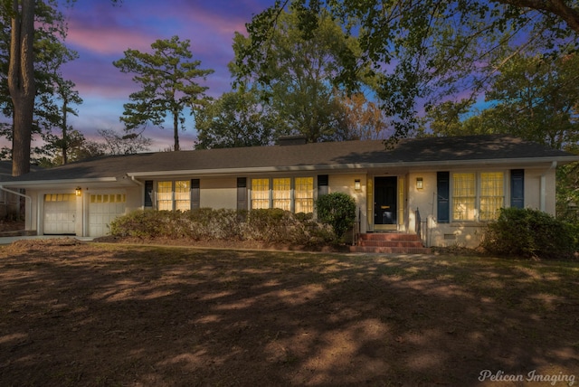 single story home with a garage