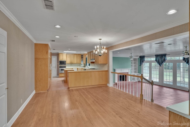 kitchen with french doors, light wood-type flooring, appliances with stainless steel finishes, backsplash, and light brown cabinets