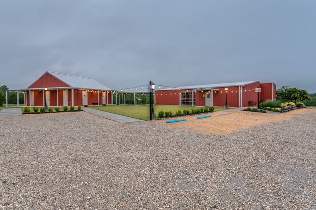 view of front facade featuring an outbuilding