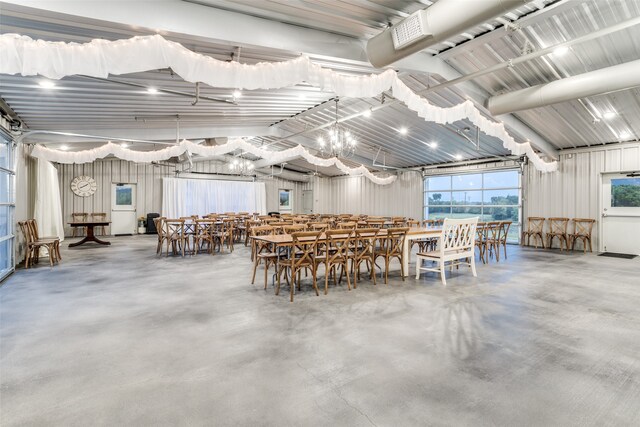 unfurnished dining area with concrete floors