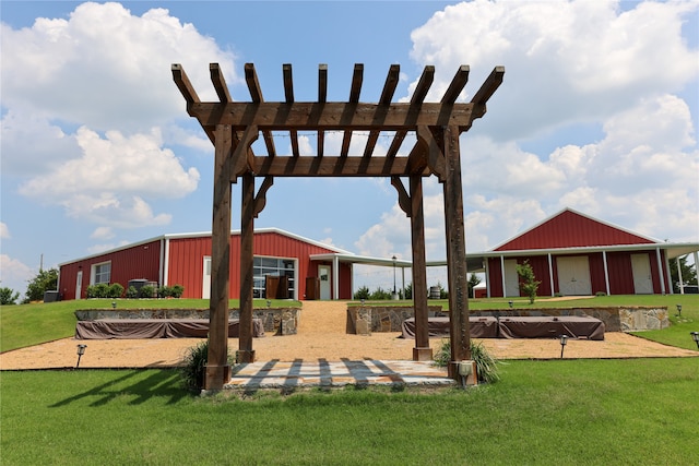 view of home's community with a yard and an outdoor structure