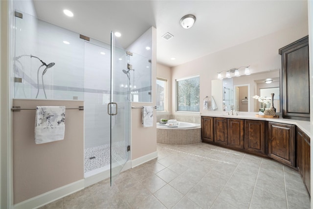 bathroom featuring vanity, tile patterned floors, and separate shower and tub