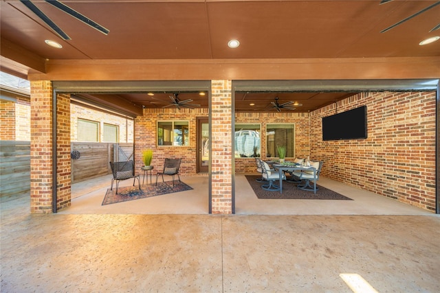 view of patio featuring ceiling fan