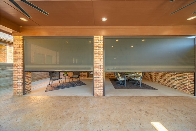 view of patio featuring ceiling fan