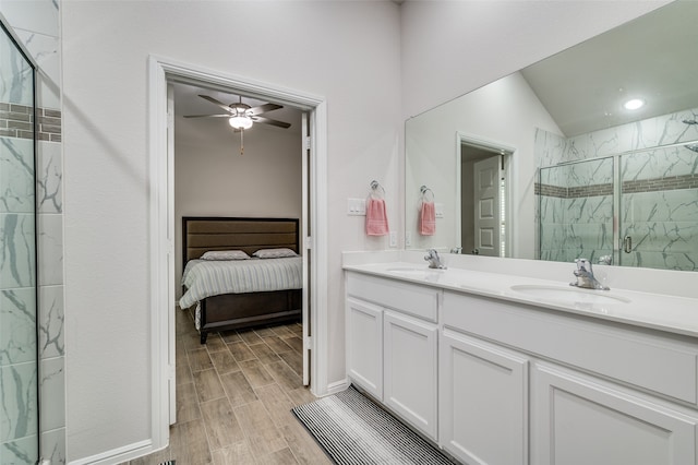 bathroom with vaulted ceiling, vanity, an enclosed shower, ceiling fan, and wood-type flooring