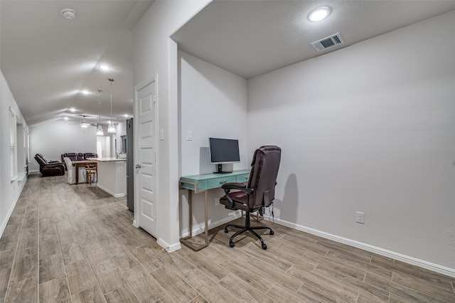 office with ceiling fan, light hardwood / wood-style flooring, and lofted ceiling