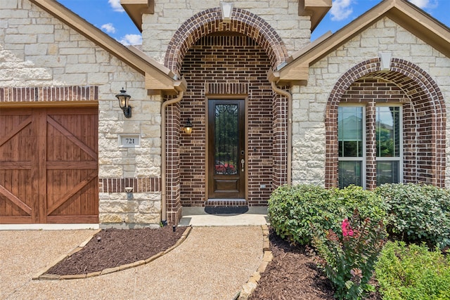 view of exterior entry featuring a garage