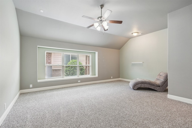 unfurnished room with ceiling fan, lofted ceiling, and carpet floors