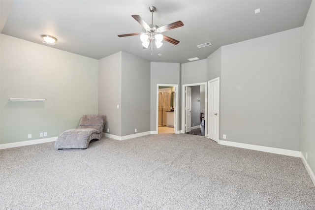 unfurnished room with carpet and ceiling fan