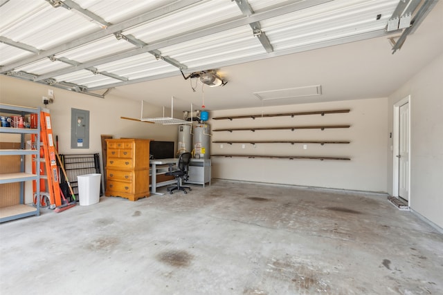 garage featuring electric panel and a garage door opener