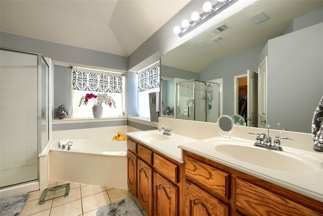 bathroom featuring tile patterned flooring, vanity, lofted ceiling, and plus walk in shower