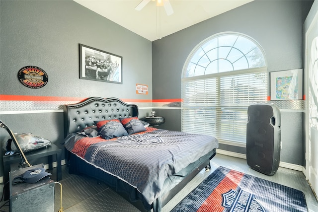 bedroom featuring ceiling fan and carpet