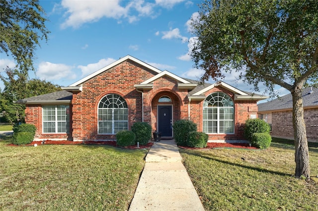 ranch-style home with a front lawn