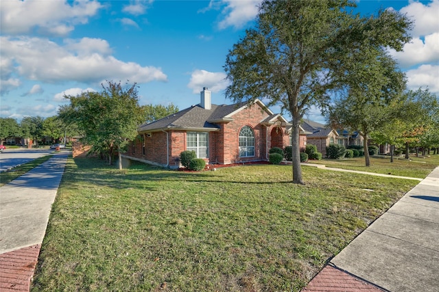 single story home with a front lawn