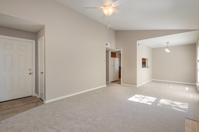 carpeted empty room with ceiling fan and lofted ceiling