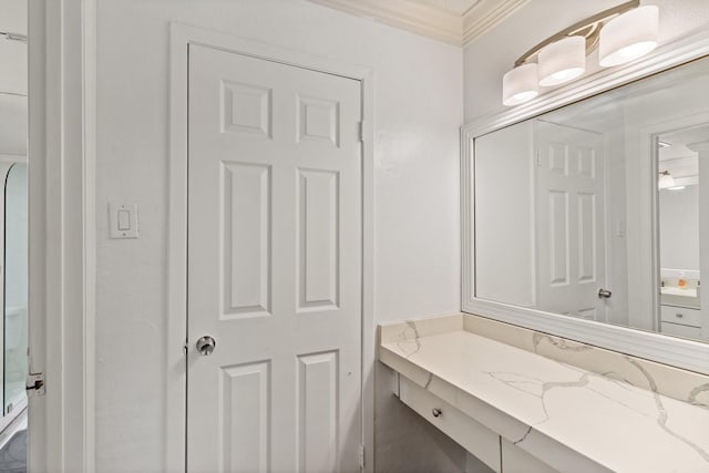 bathroom with vanity and crown molding