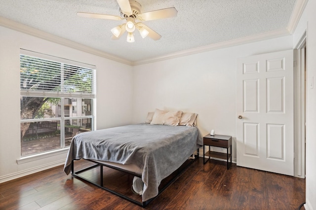 bedroom featuring a textured ceiling, dark hardwood / wood-style floors, ceiling fan, and crown molding