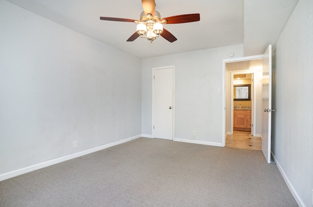 unfurnished bedroom featuring ceiling fan and carpet floors