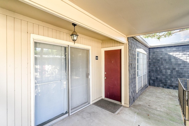 property entrance featuring a patio