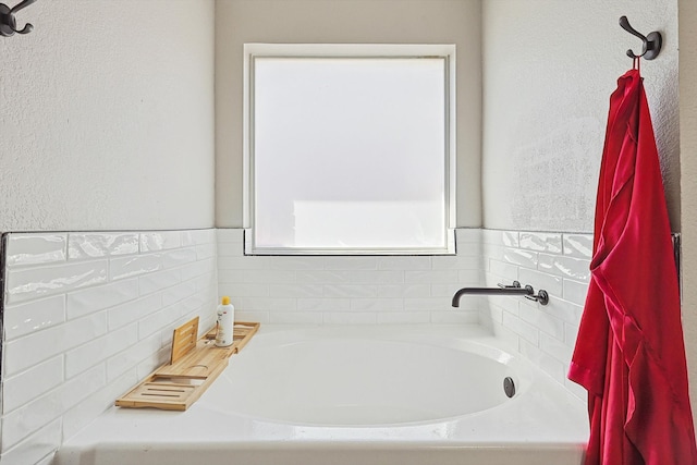 bathroom with a washtub