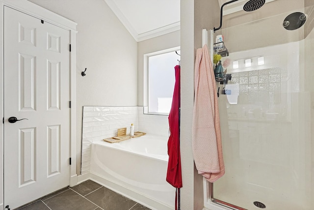 bathroom with tile patterned floors, lofted ceiling, ornamental molding, and independent shower and bath