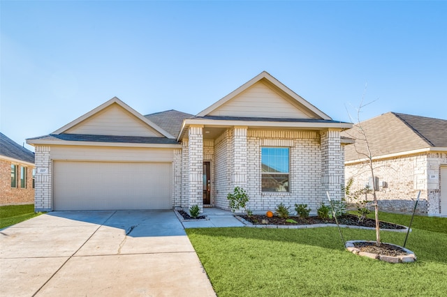 view of front of house with a garage and a front yard