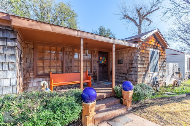 property entrance featuring covered porch