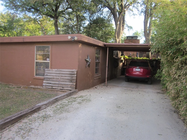 view of home's exterior featuring a carport