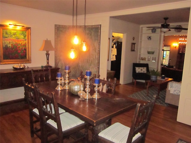 dining room featuring ceiling fan and dark hardwood / wood-style floors