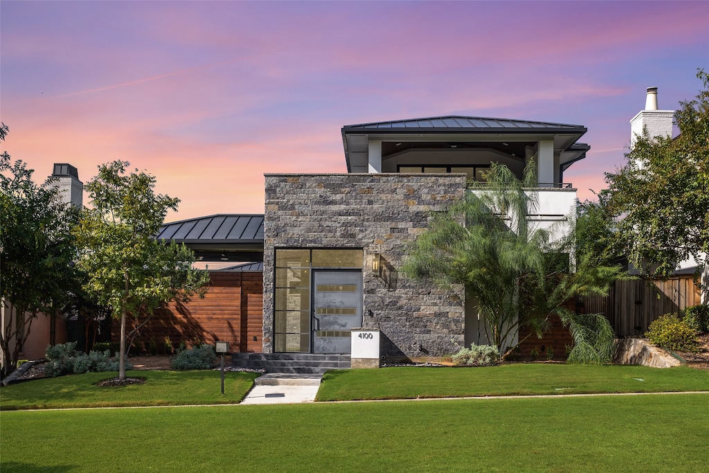 modern home with a lawn