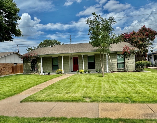 ranch-style home featuring a front yard