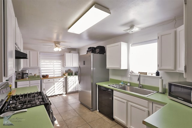 kitchen with ceiling fan, sink, black appliances, light tile patterned floors, and white cabinets